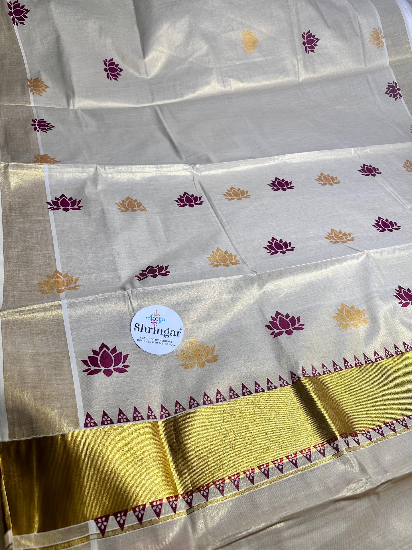 Kerala Saree with  maroon /deep burgundy and gold lotus motifs