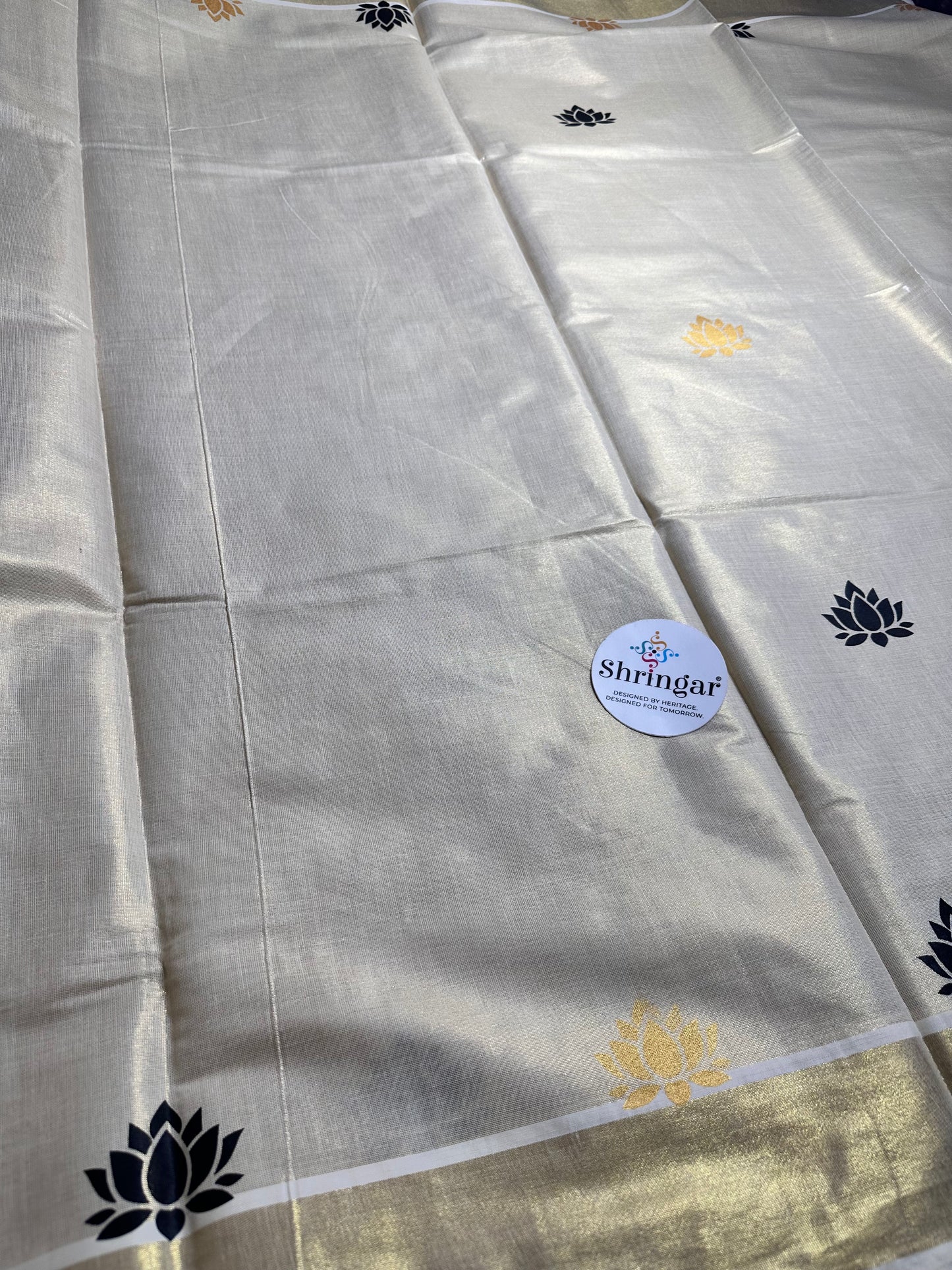 Kerala Saree with black and gold lotus motifs
