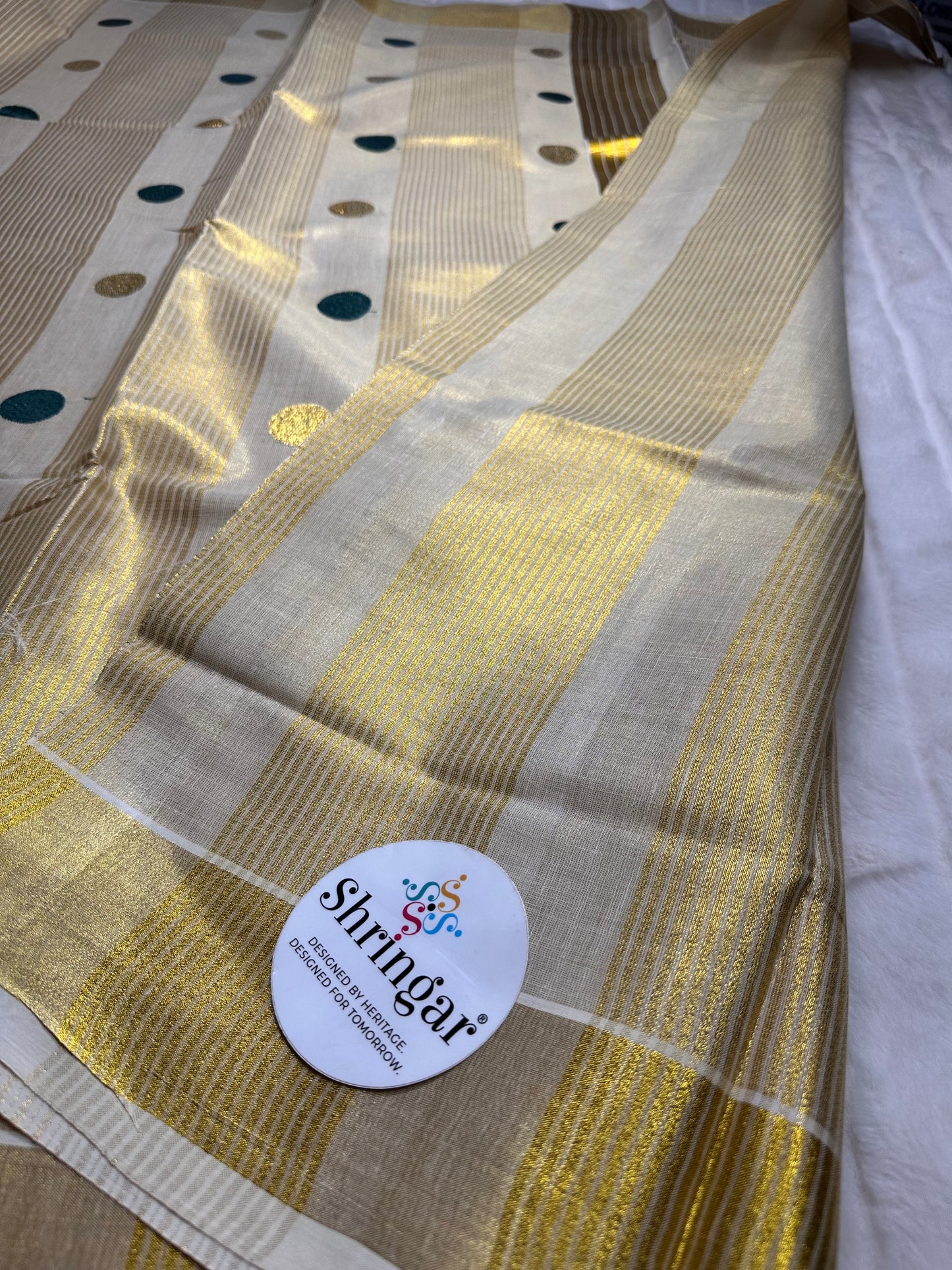 Kerala Onam Tissue Saree ( green polka dots in Pallu)