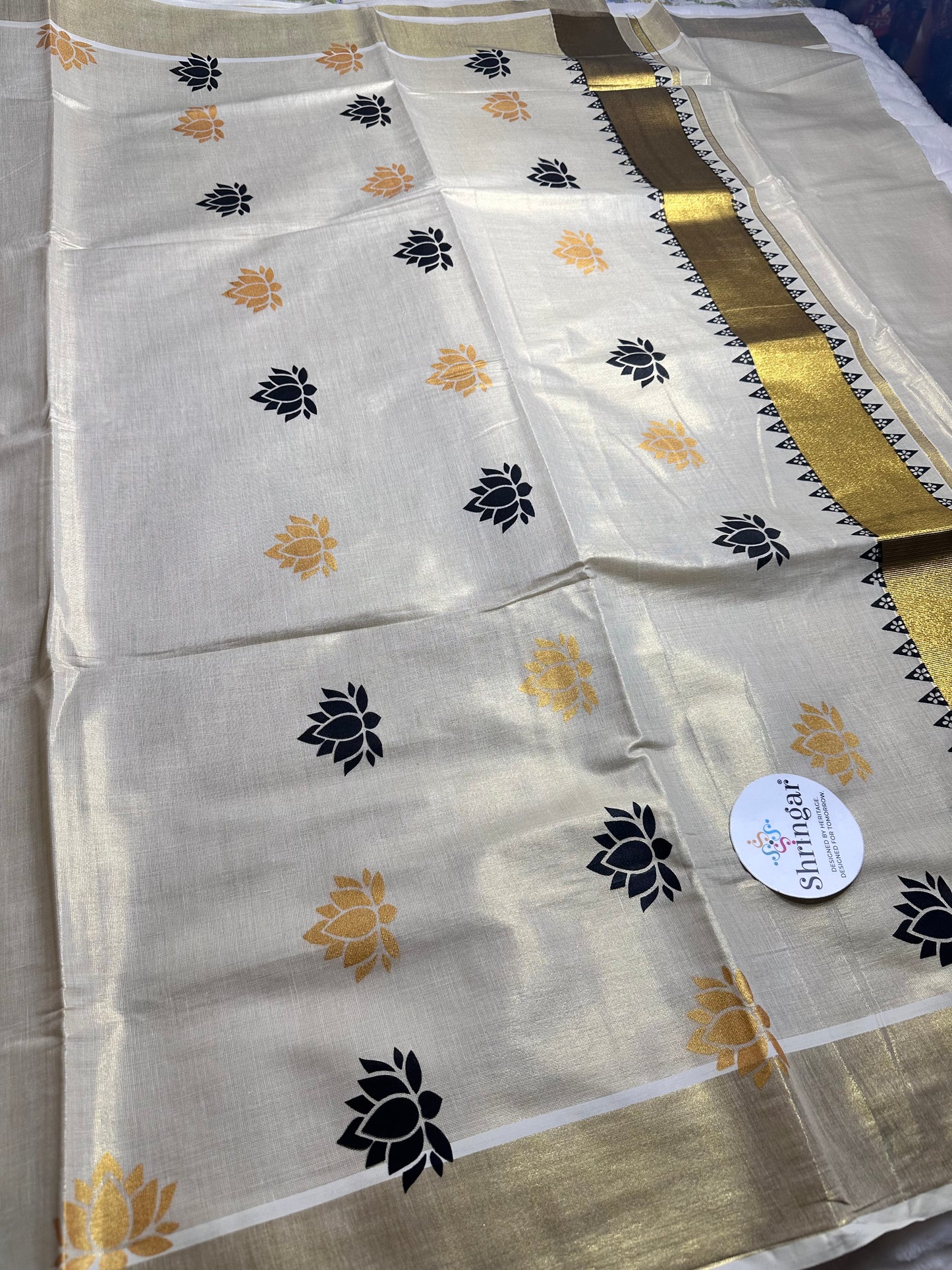 Kerala Saree with black and gold lotus motifs