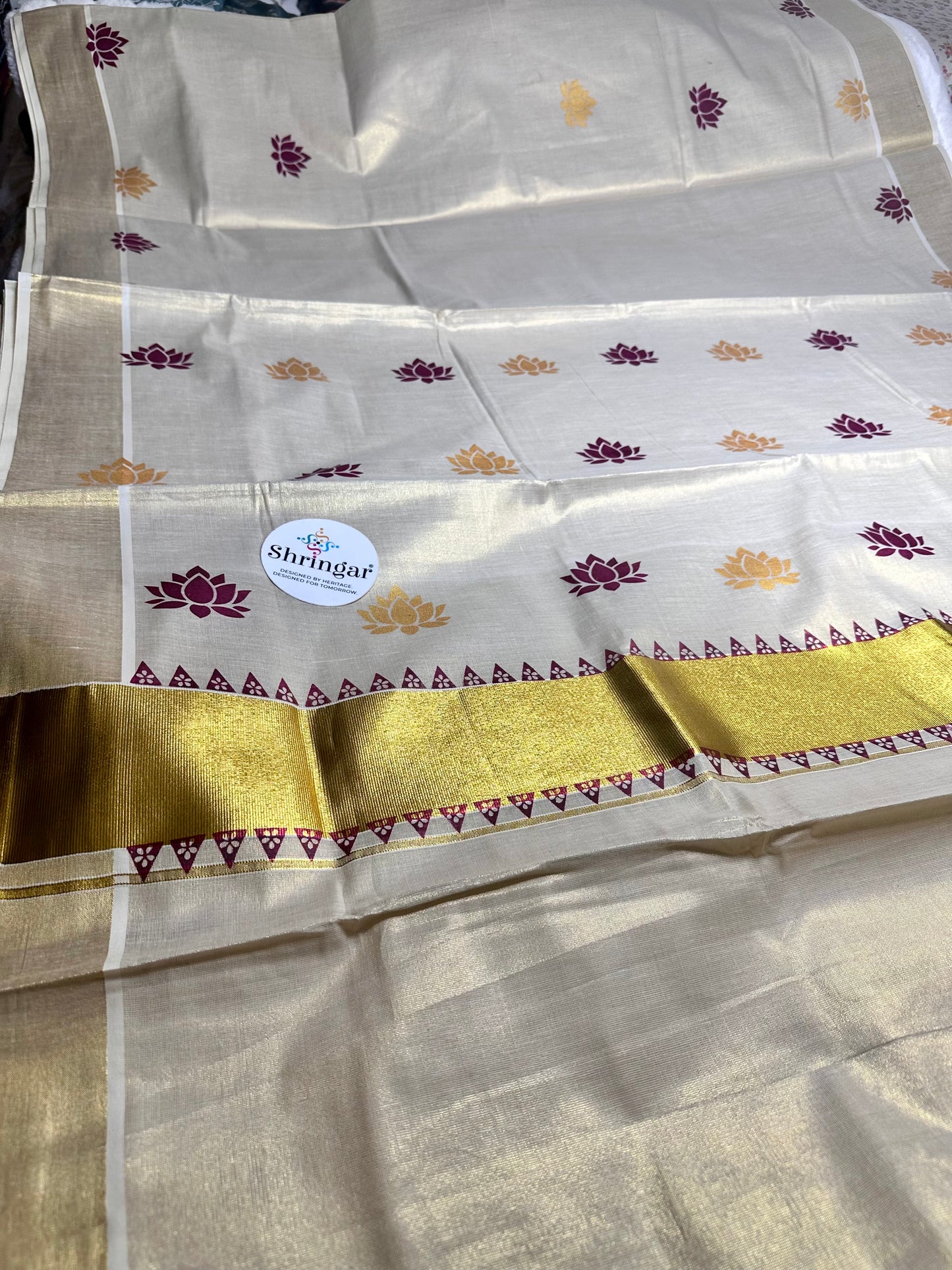 Kerala Saree with  maroon /deep burgundy and gold lotus motifs