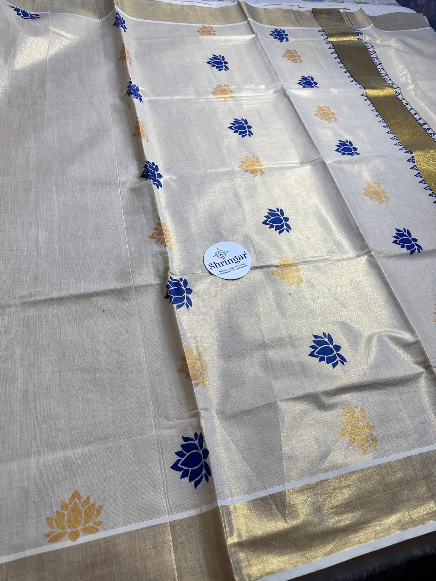Kerala Saree with blue and gold lotus motifs