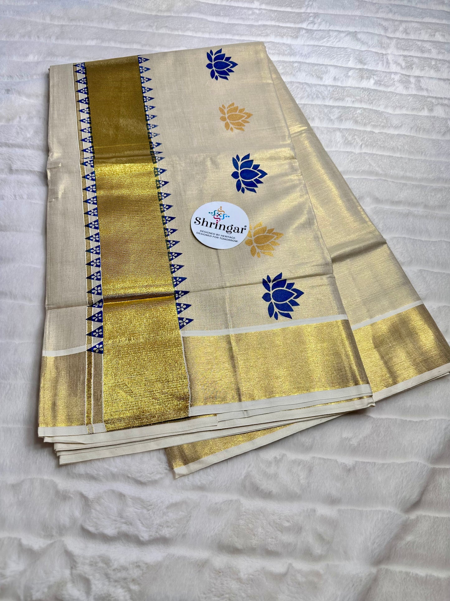 Kerala Saree with blue and gold lotus motifs