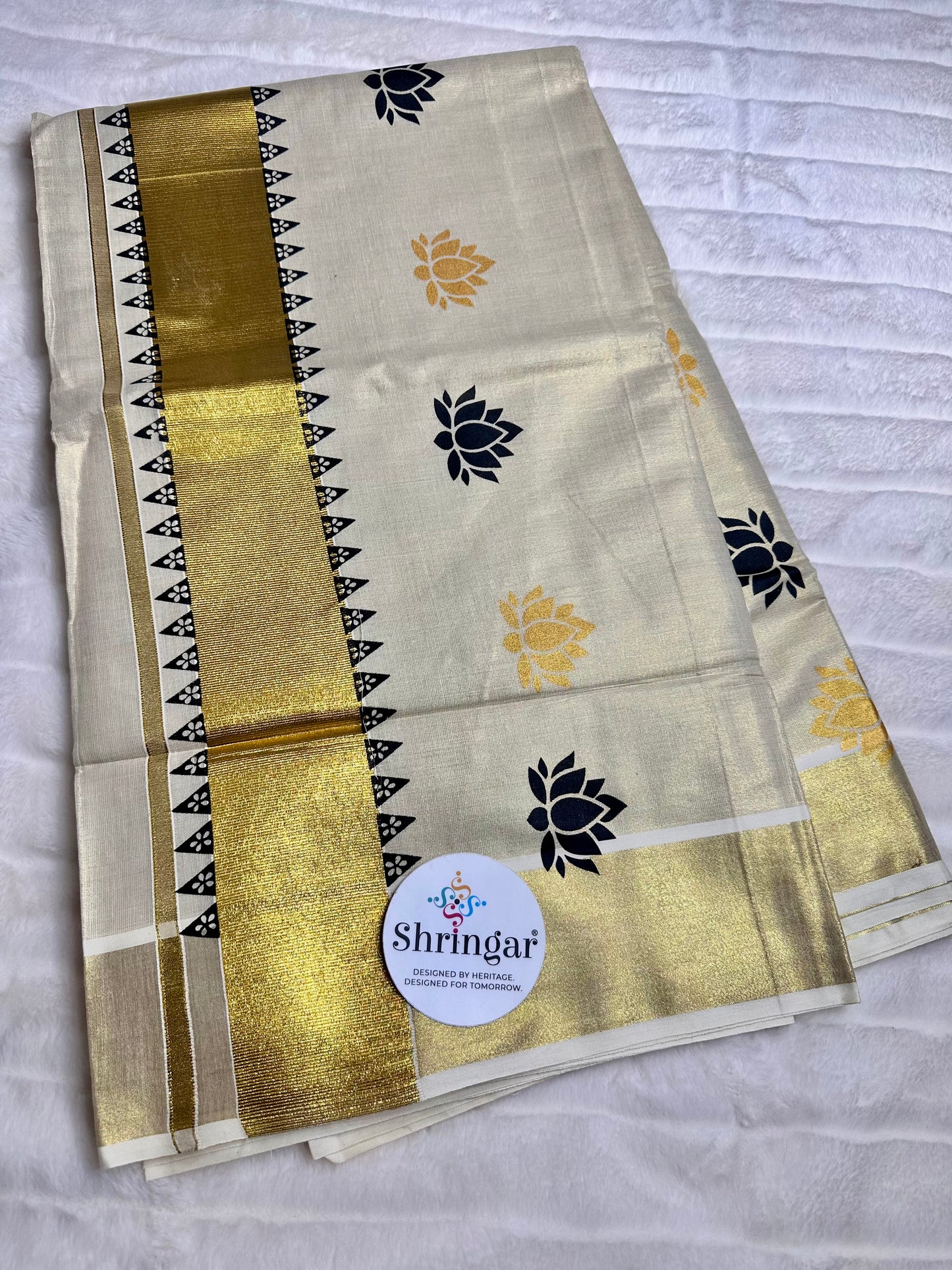 Kerala Saree with black and gold lotus motifs