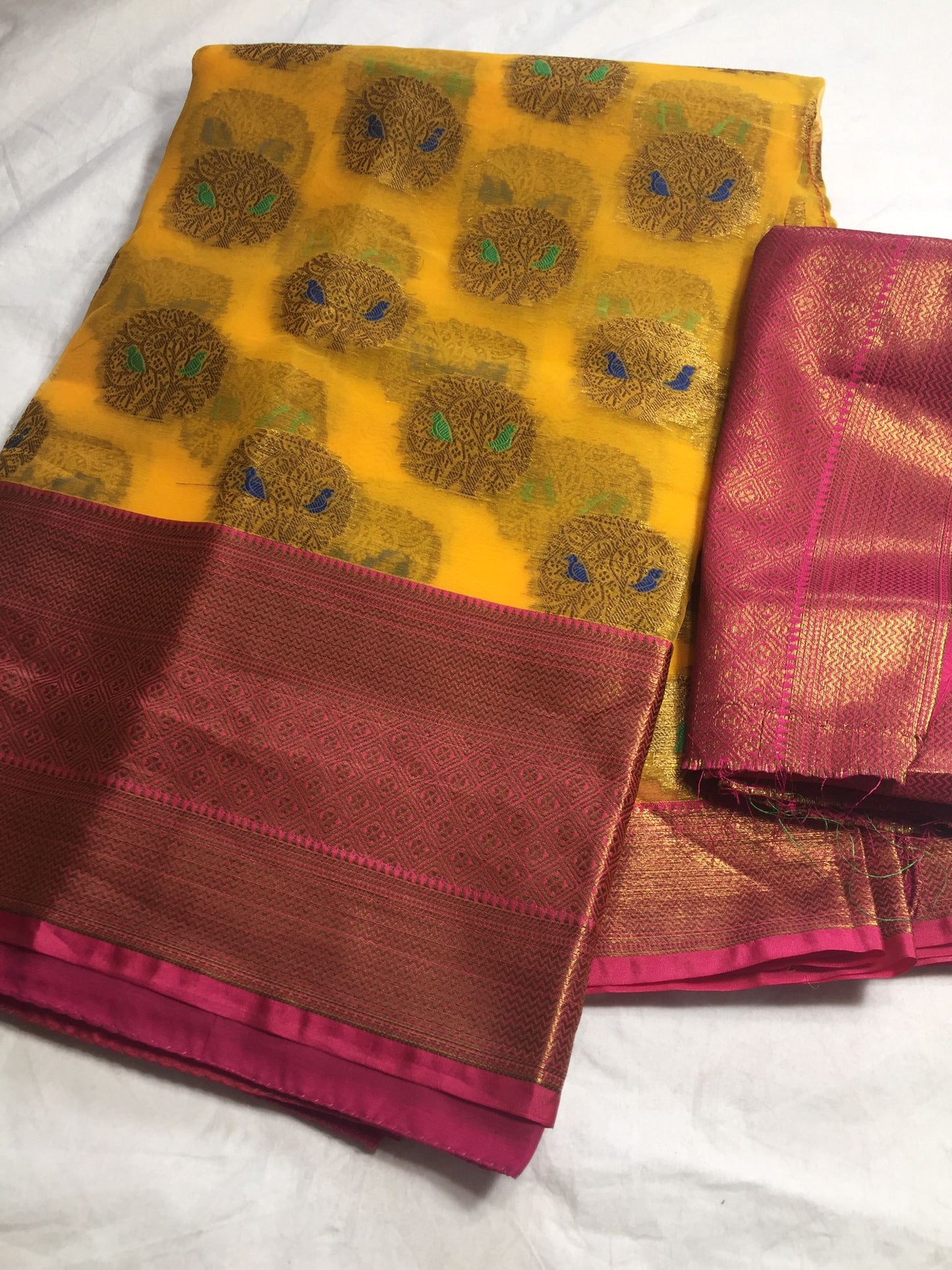 Organza saree with Kanchi border and brocade blouse fabric