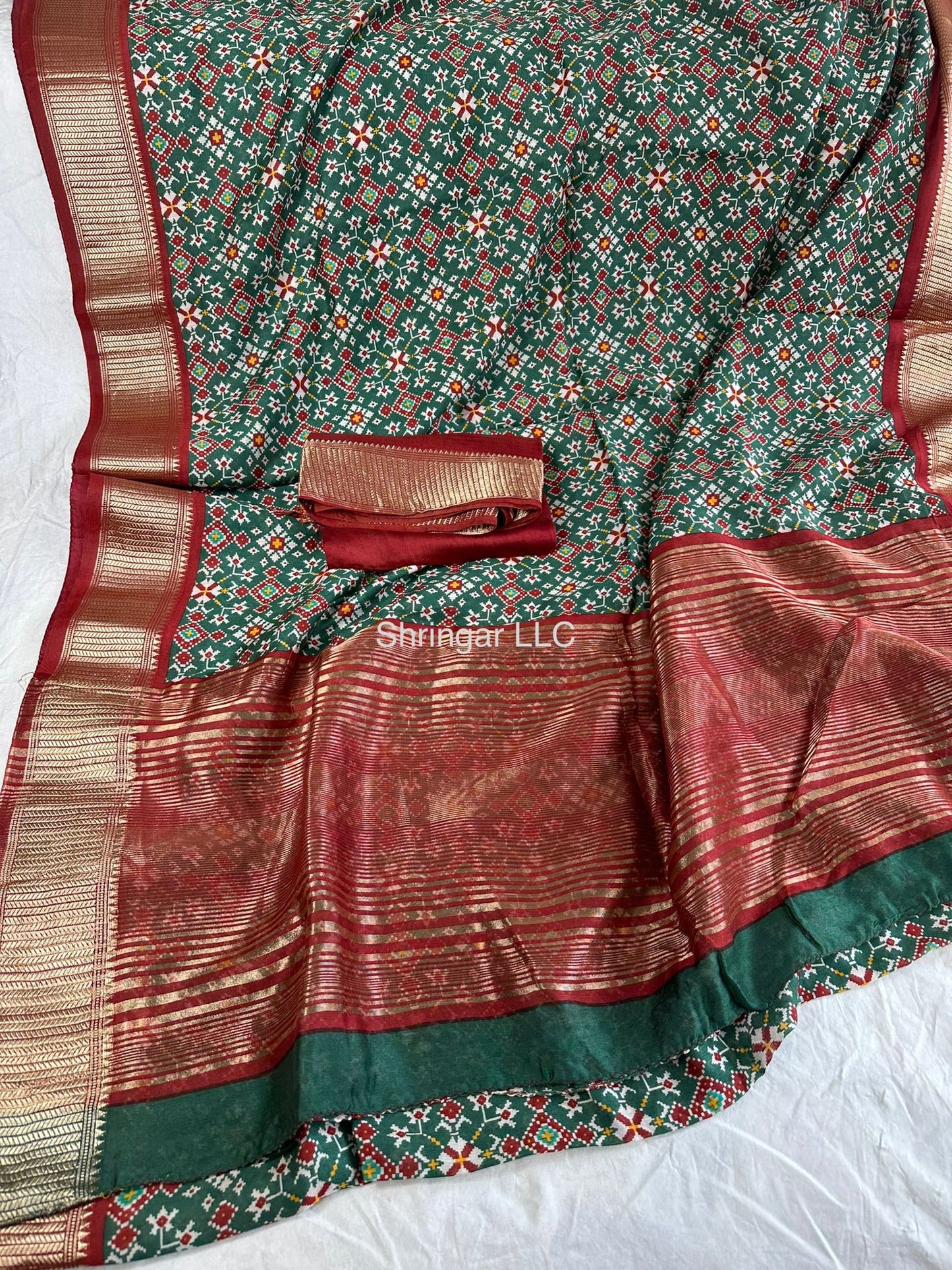 Light weight Binny crepe saree with all over Patola print and jari weaving border and pallu